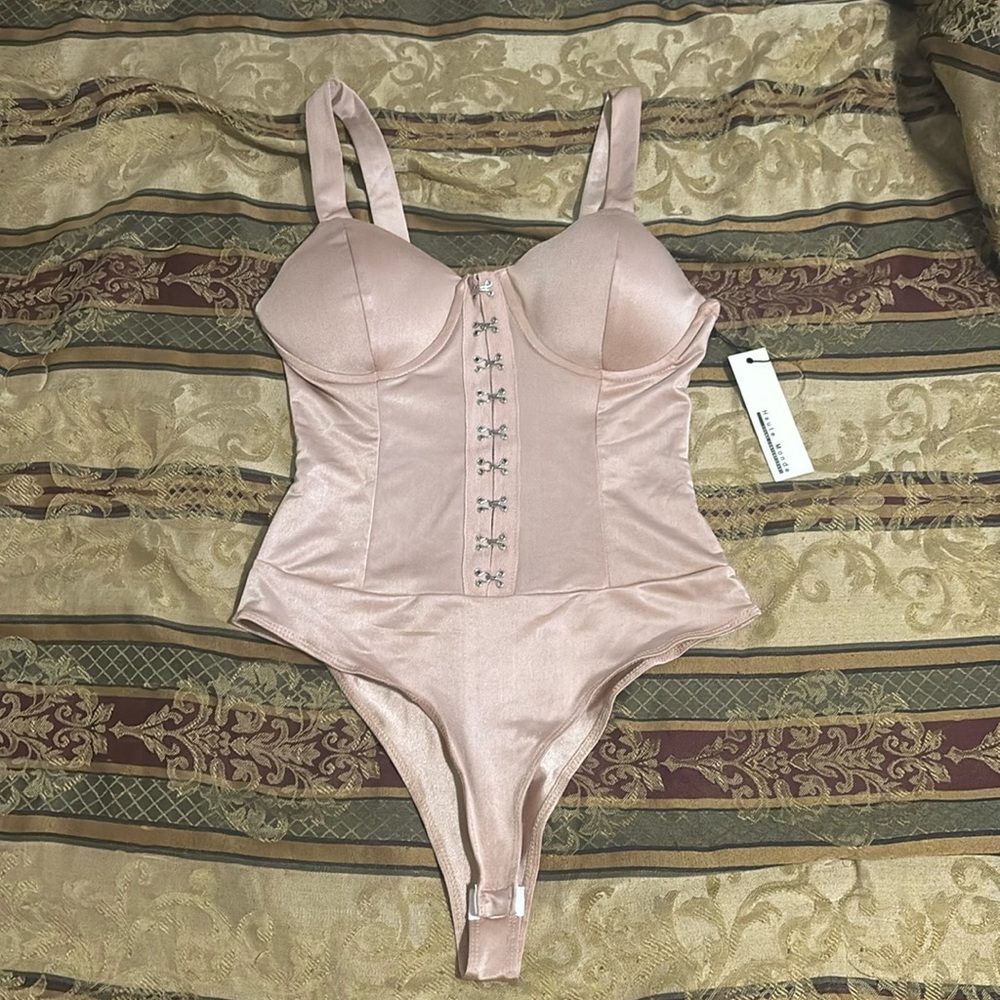BRAND NEW . Haute monde young contemporary. Nude blush bodysuit .